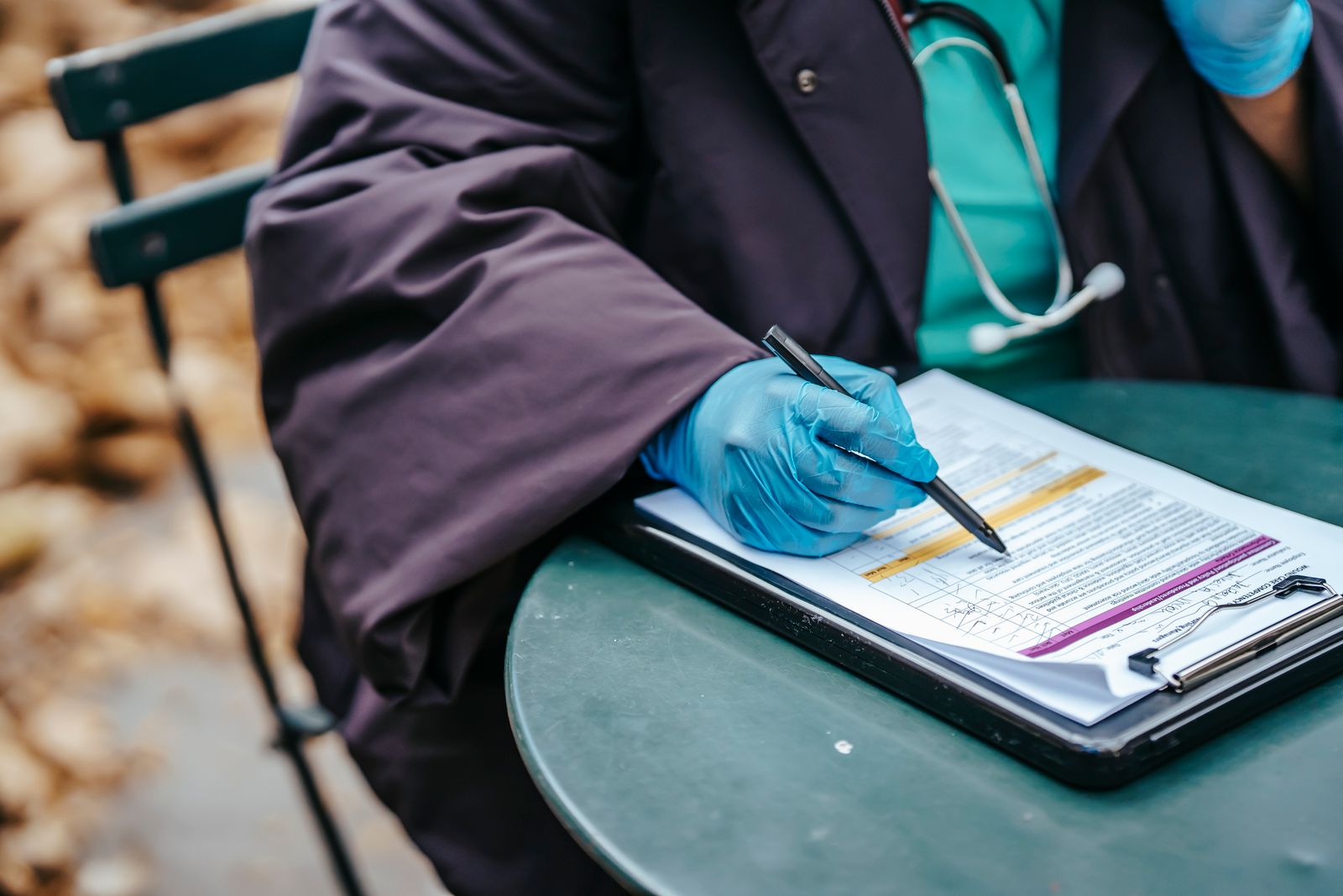 A clinician reviewing medical documentation against coding requirements